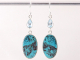 53966 Lange zilveren oorbellen met chrysocolla en blauwe topaas