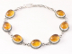 31768 Bewerkte zilveren armband met amber
